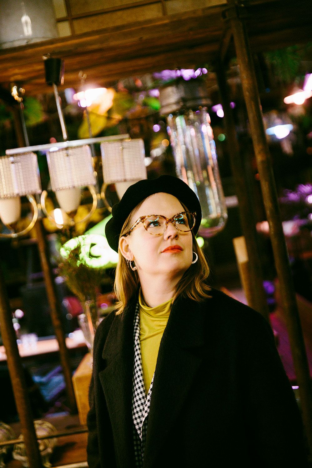 Karin Fornander in a dimly lit Berlin cafe