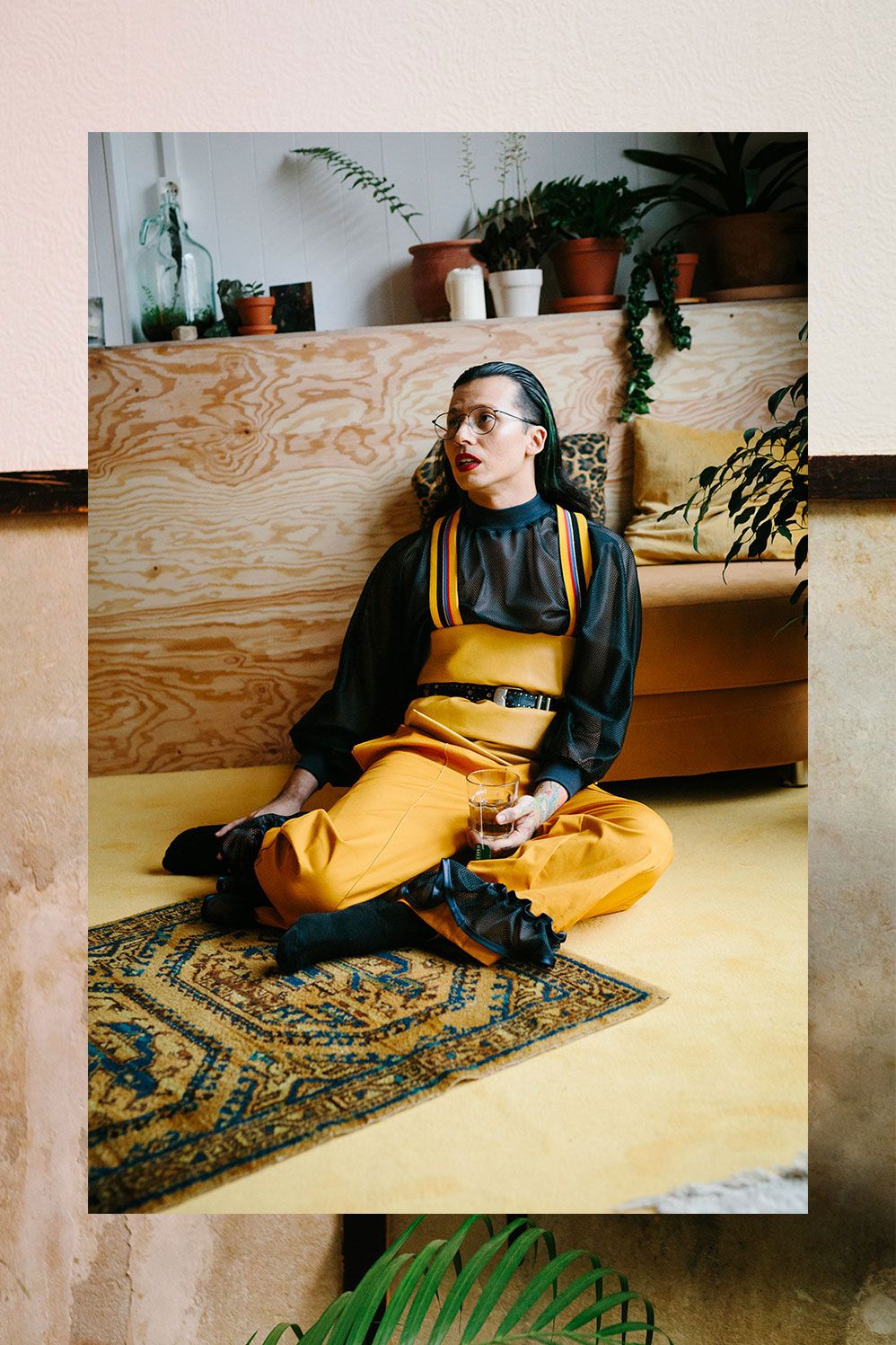Mikey Woodbridge seated on a rug in a sunlit Berlin flat
