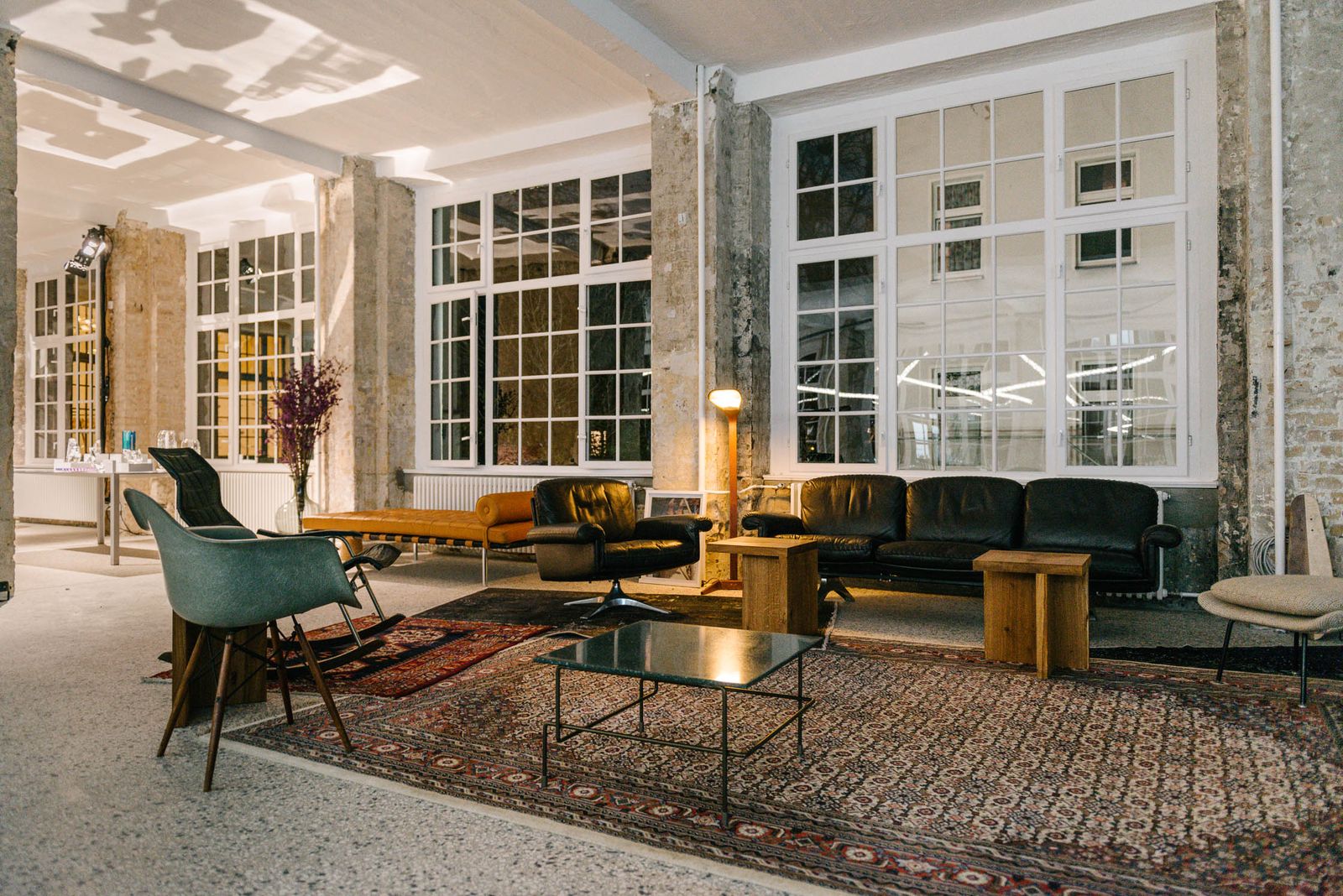 Lounge with leather sofas and rugs in the Friends Space, set for the AD Design Award