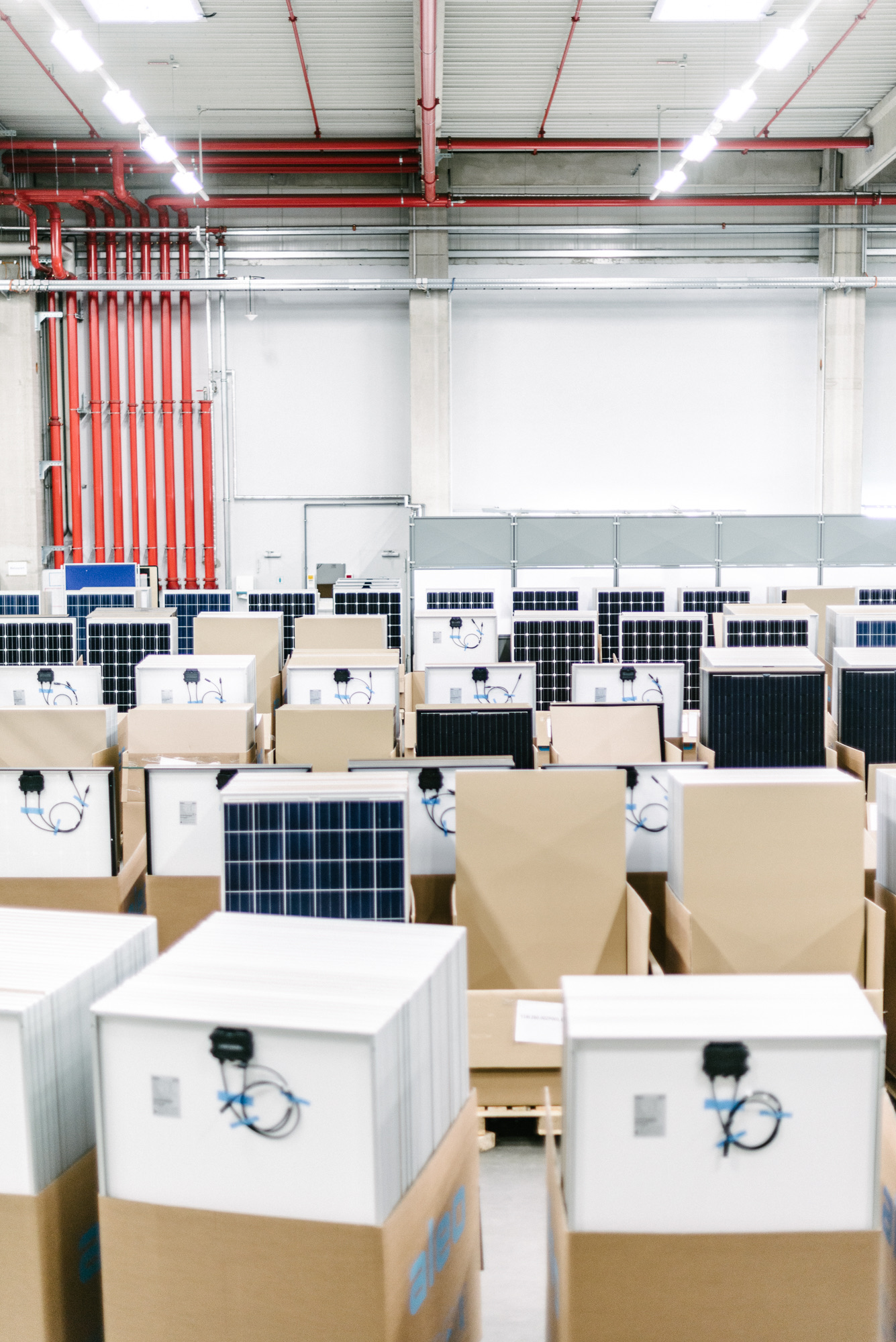 Packed aleo solar panels stacked in the warehouse