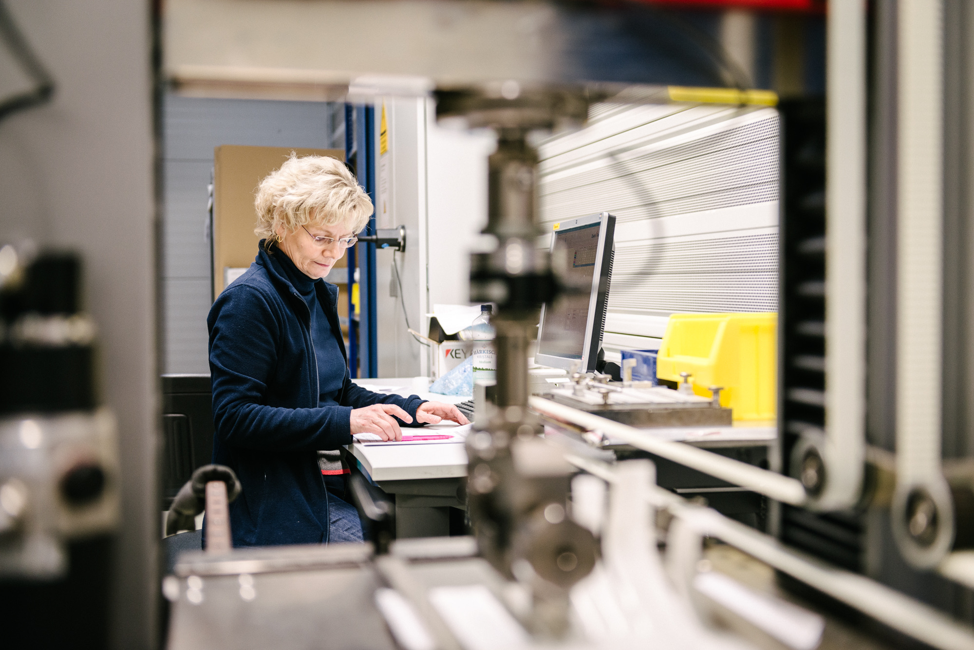 Quality control at an aleo solar workstation on the factory floor