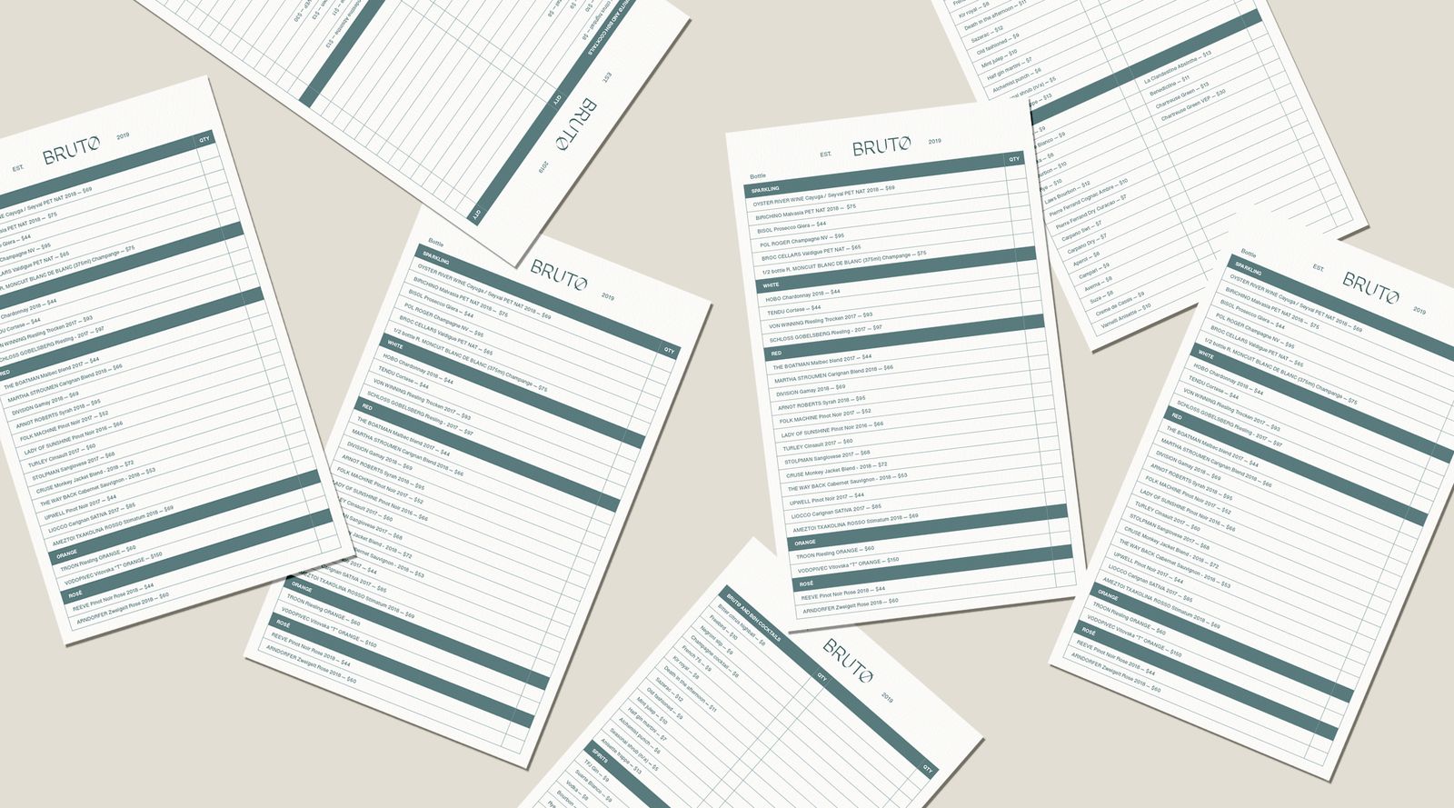 Printed Brutø menus scattered on a table