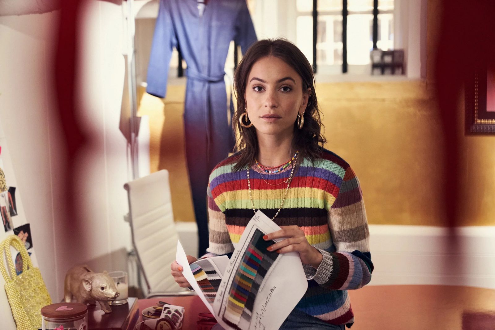 Stylist in a striped jumper at her Amsterdam studio desk, ClassPass #bethebalance editorial