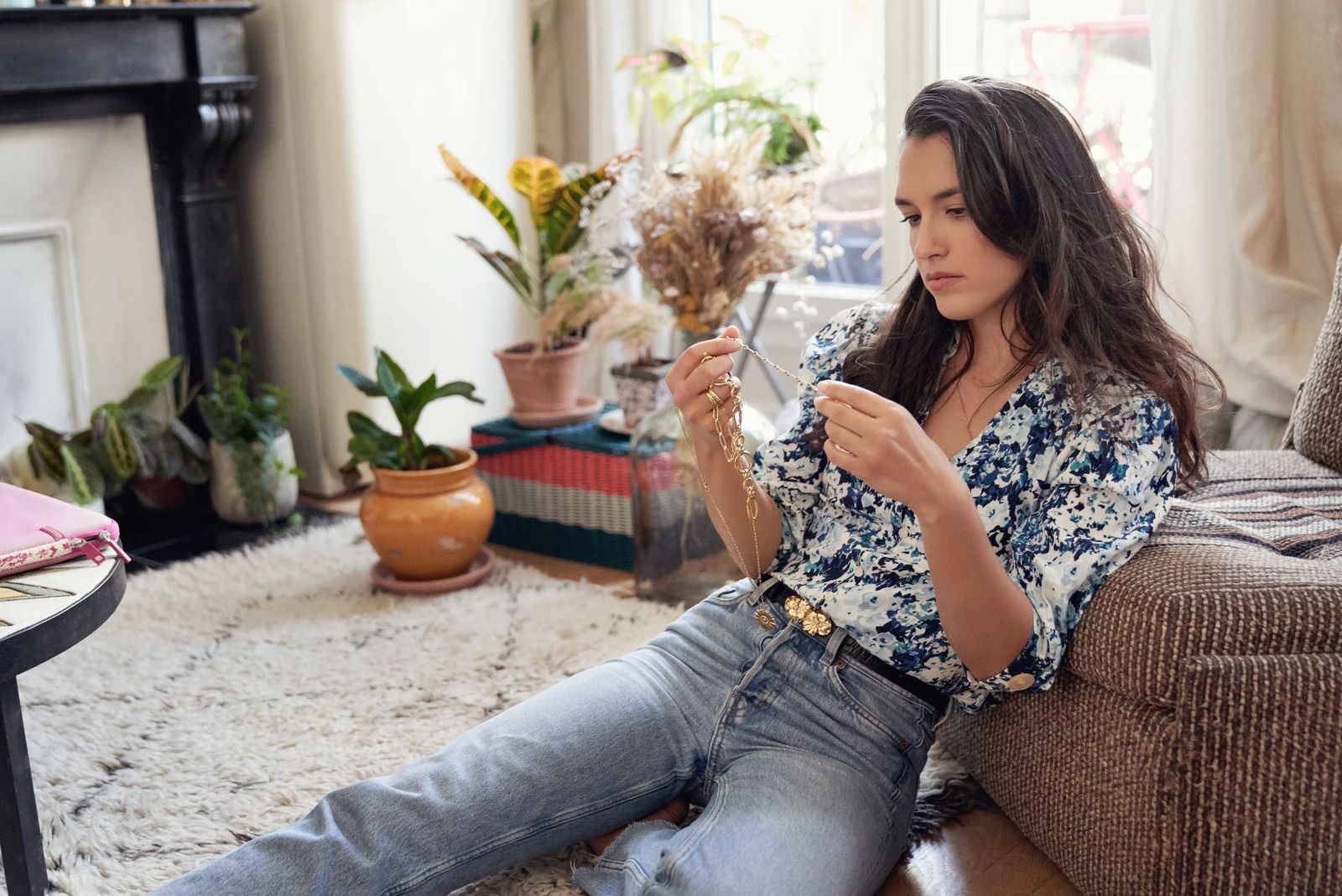 Jewellery designer arranging dried flowers in her Paris apartment, ClassPass #bethebalance editorial