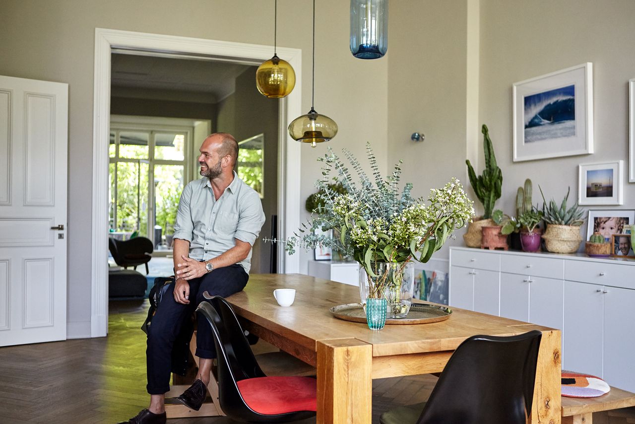 CLOSED co-owner sitting at his dining table at home in Hamburg, Archive 85 interview