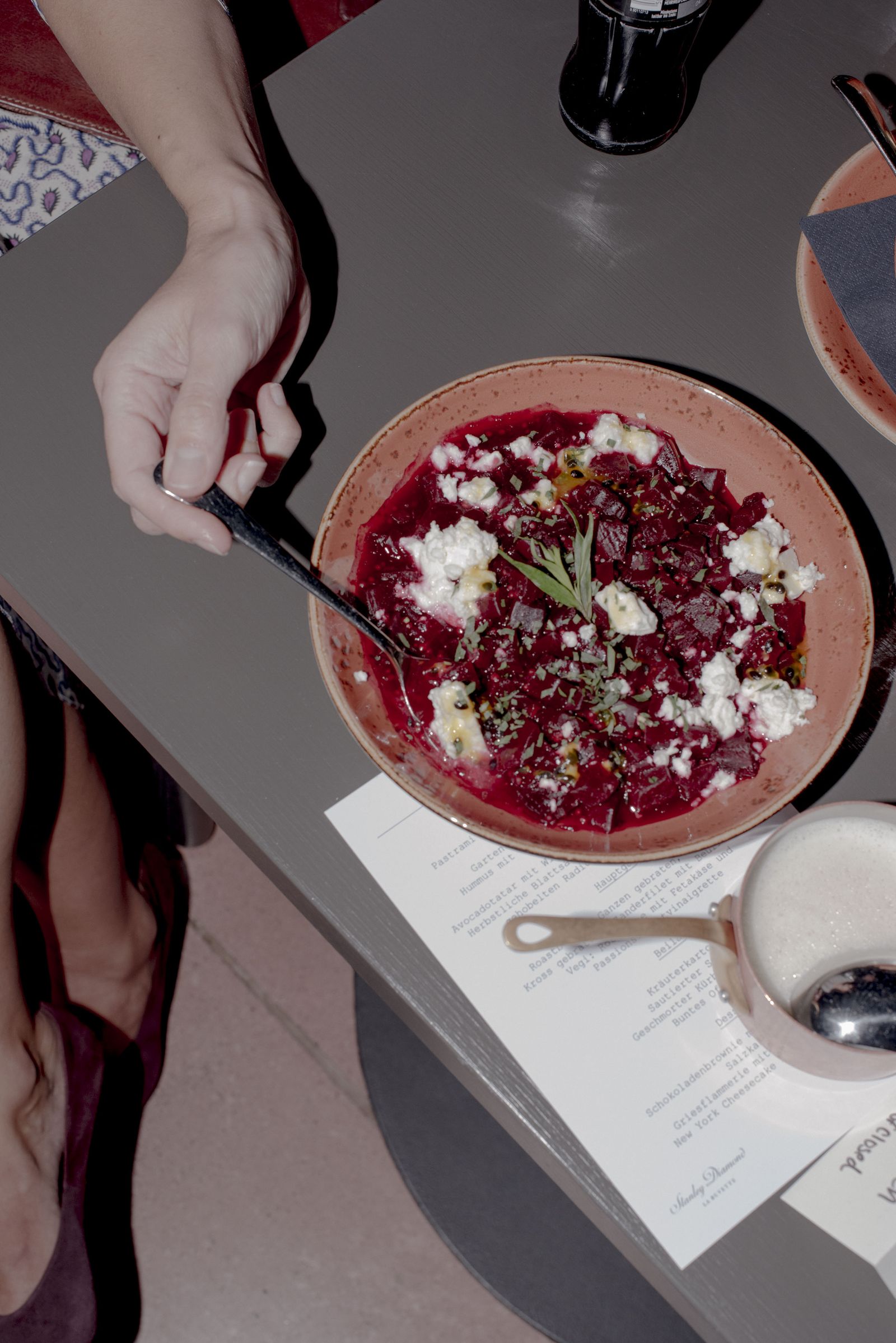 A beetroot and goat cheese dish served onto the table at the CLOSED dinner
