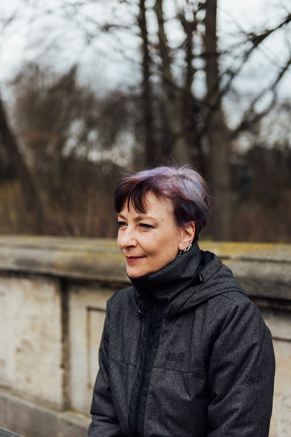 Berliner with purple hair on a stone bridge, You, Me & Berlin portrait for Hotel Berlin, Berlin