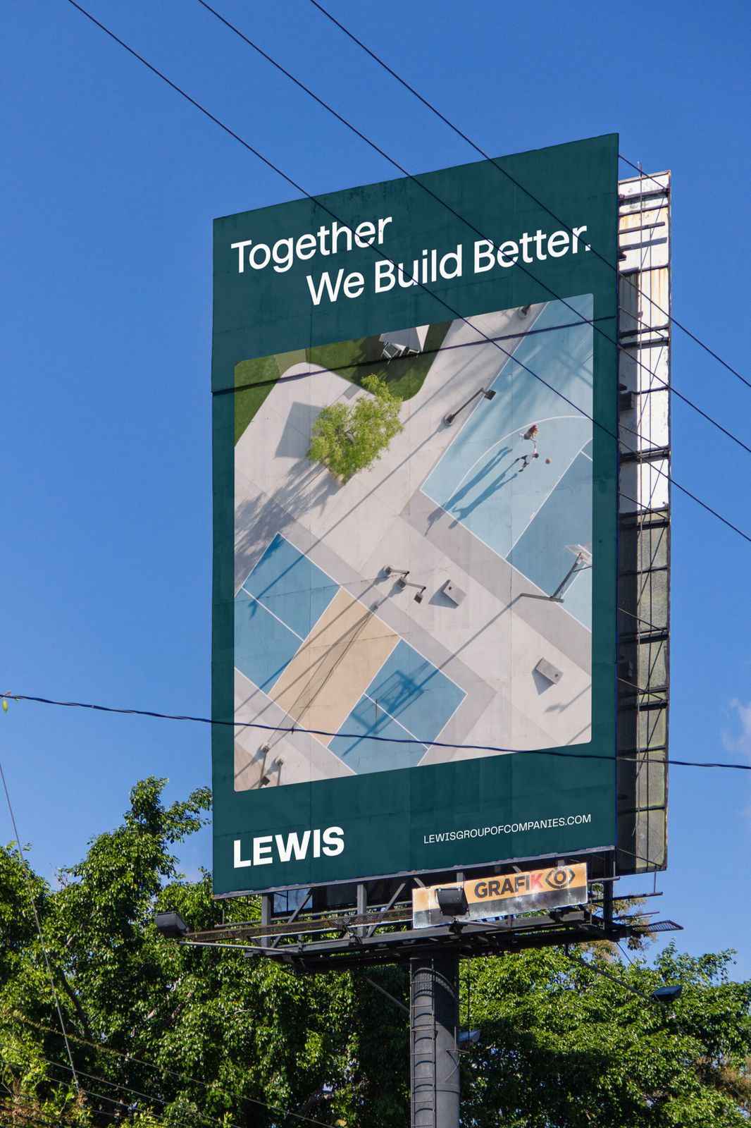 Lewis billboard reading Together We Build Better above trees