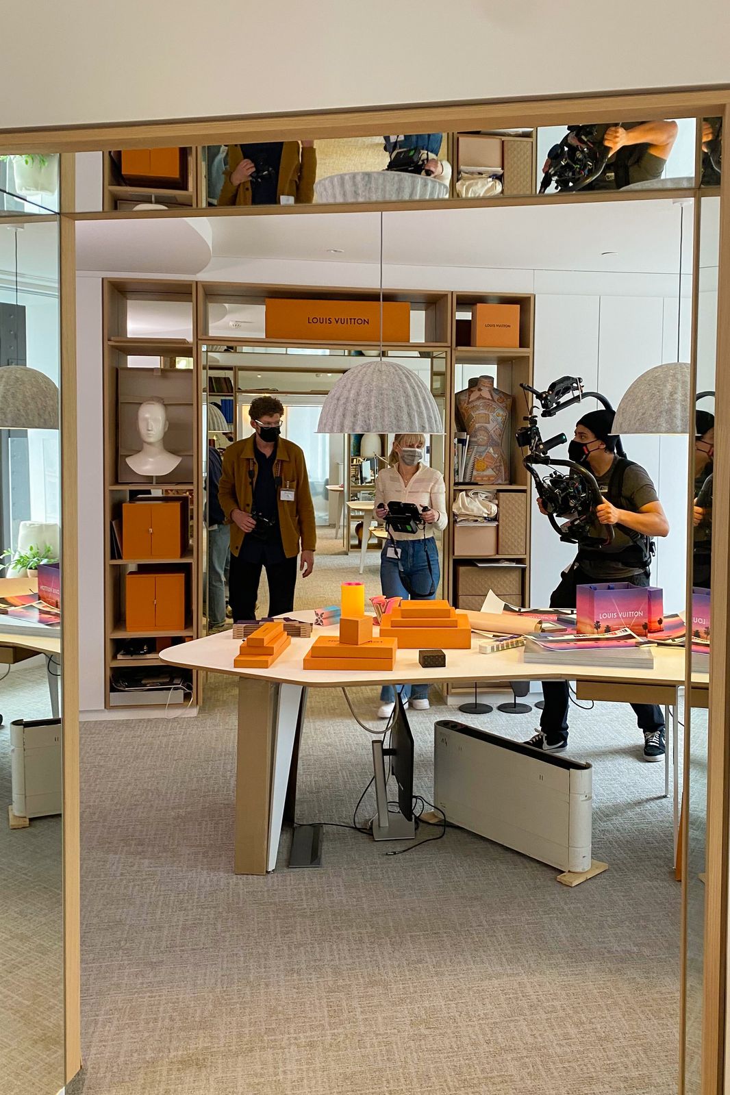 Behind the scenes: film crew shooting in a bright Louis Vuitton office