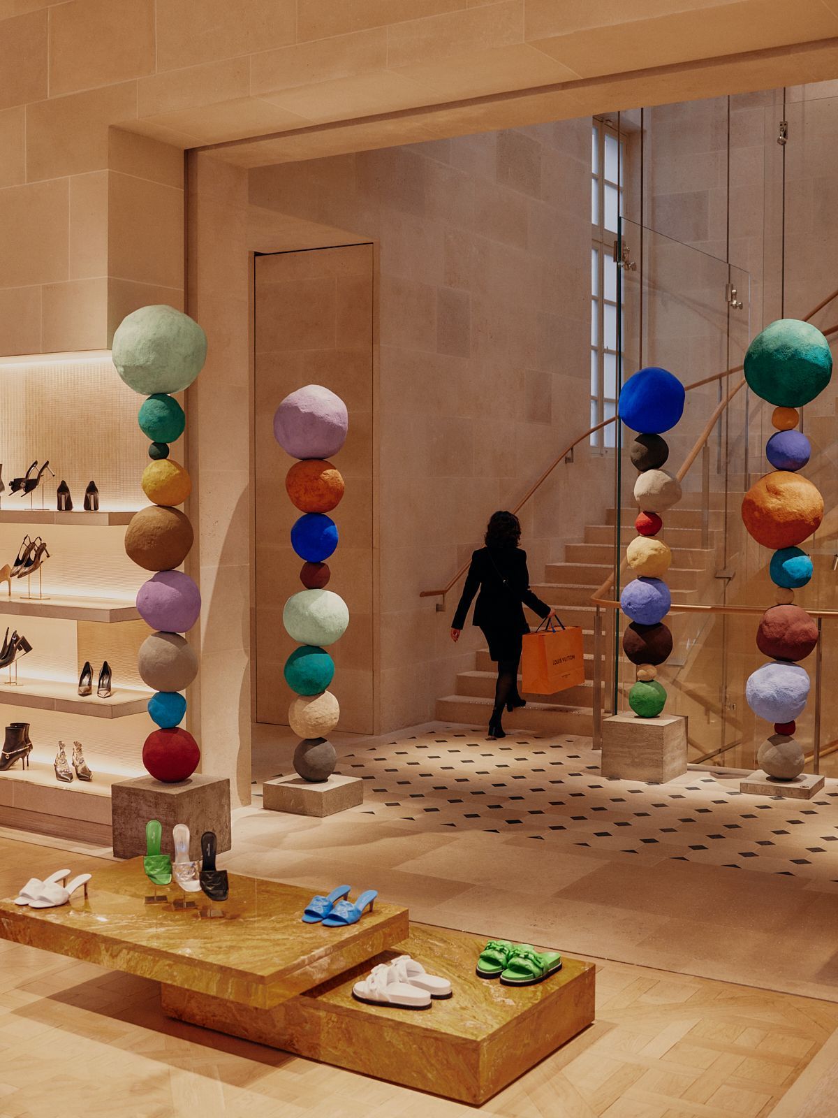 Louis Vuitton store interior with colourful bead sculptures and a staircase