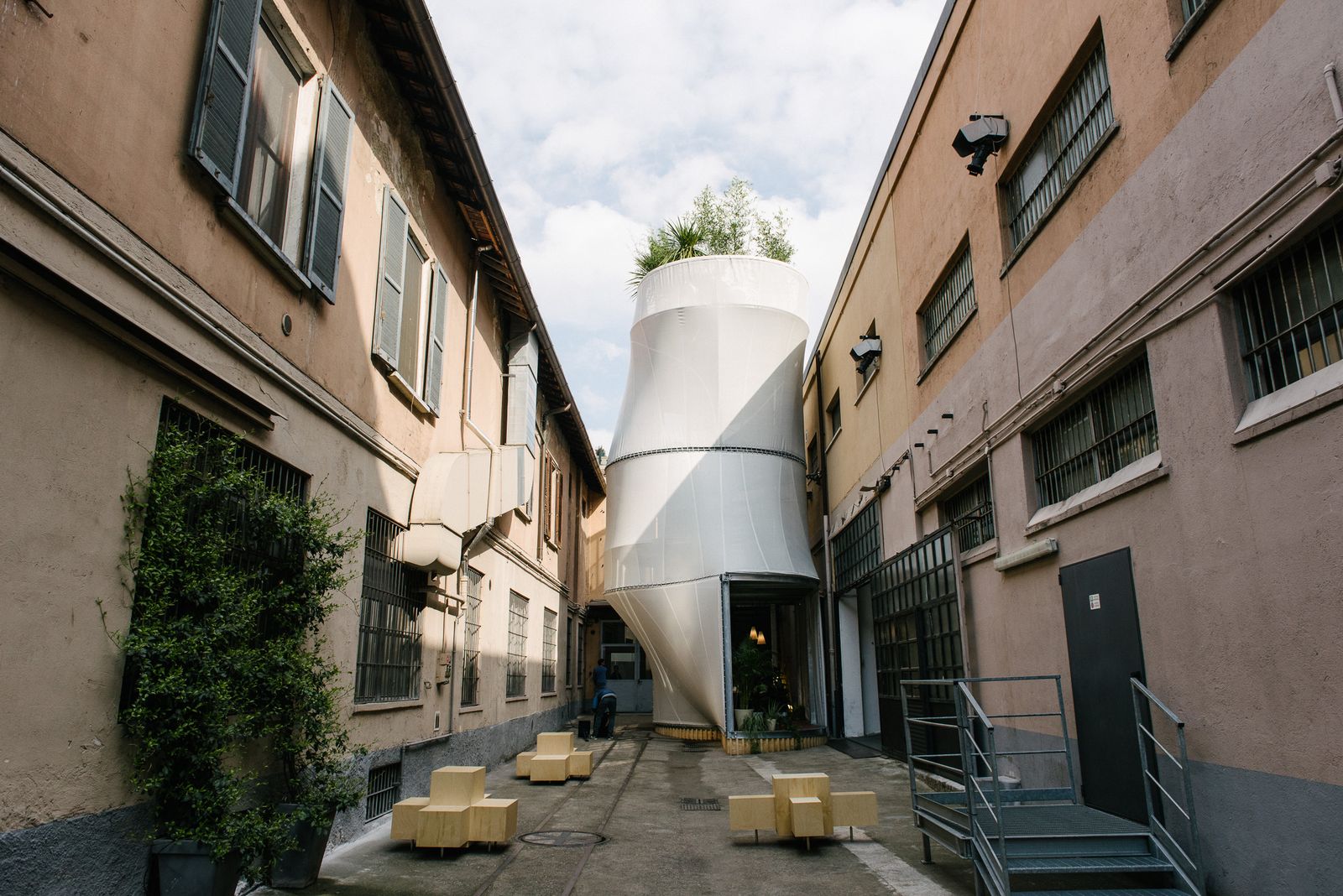 Breathe, the white mesh-clad MINI LIVING house by SO – IL, in a narrow Milan courtyard