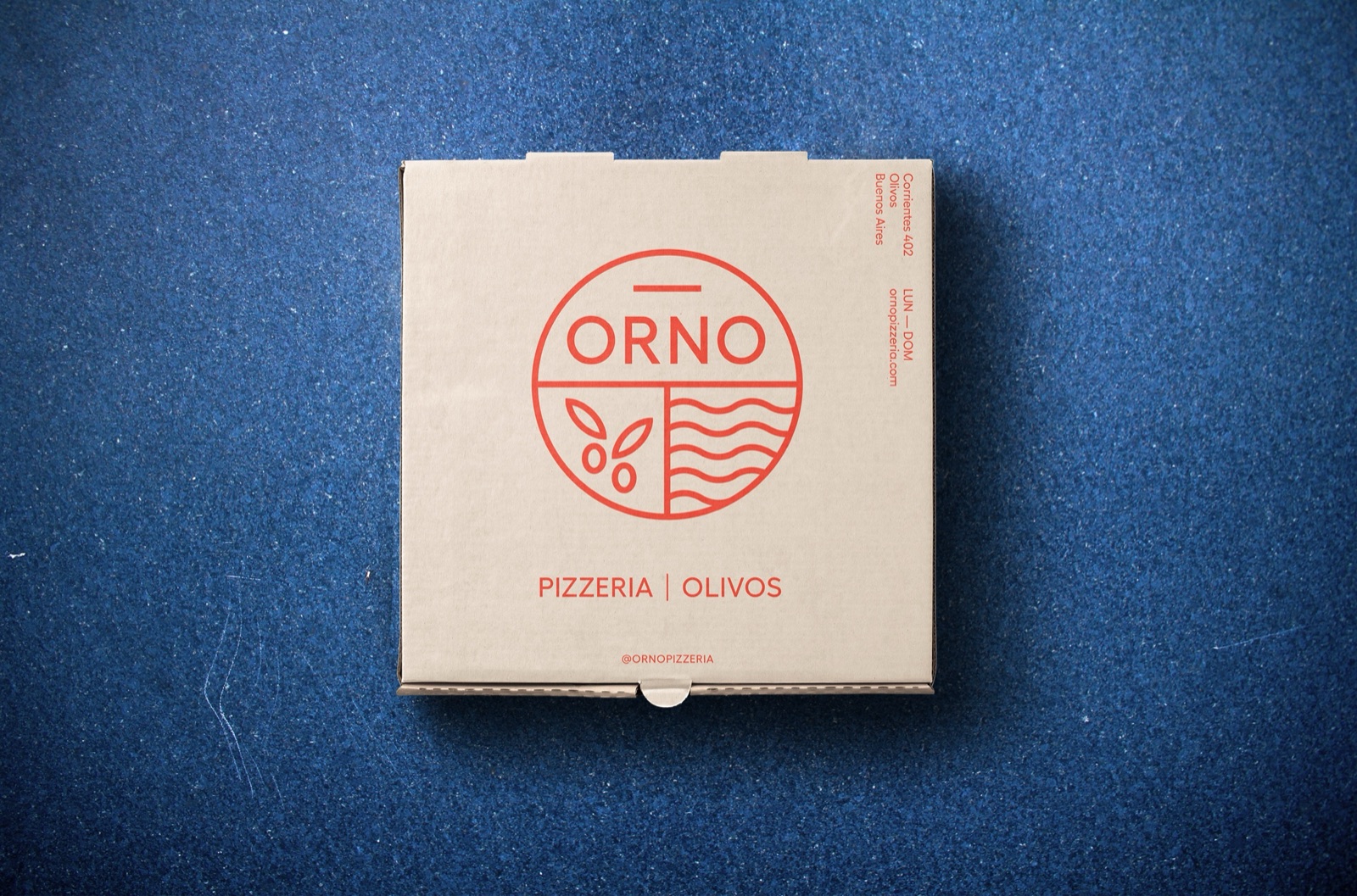ORNO pizza box with the red logo on a blue background