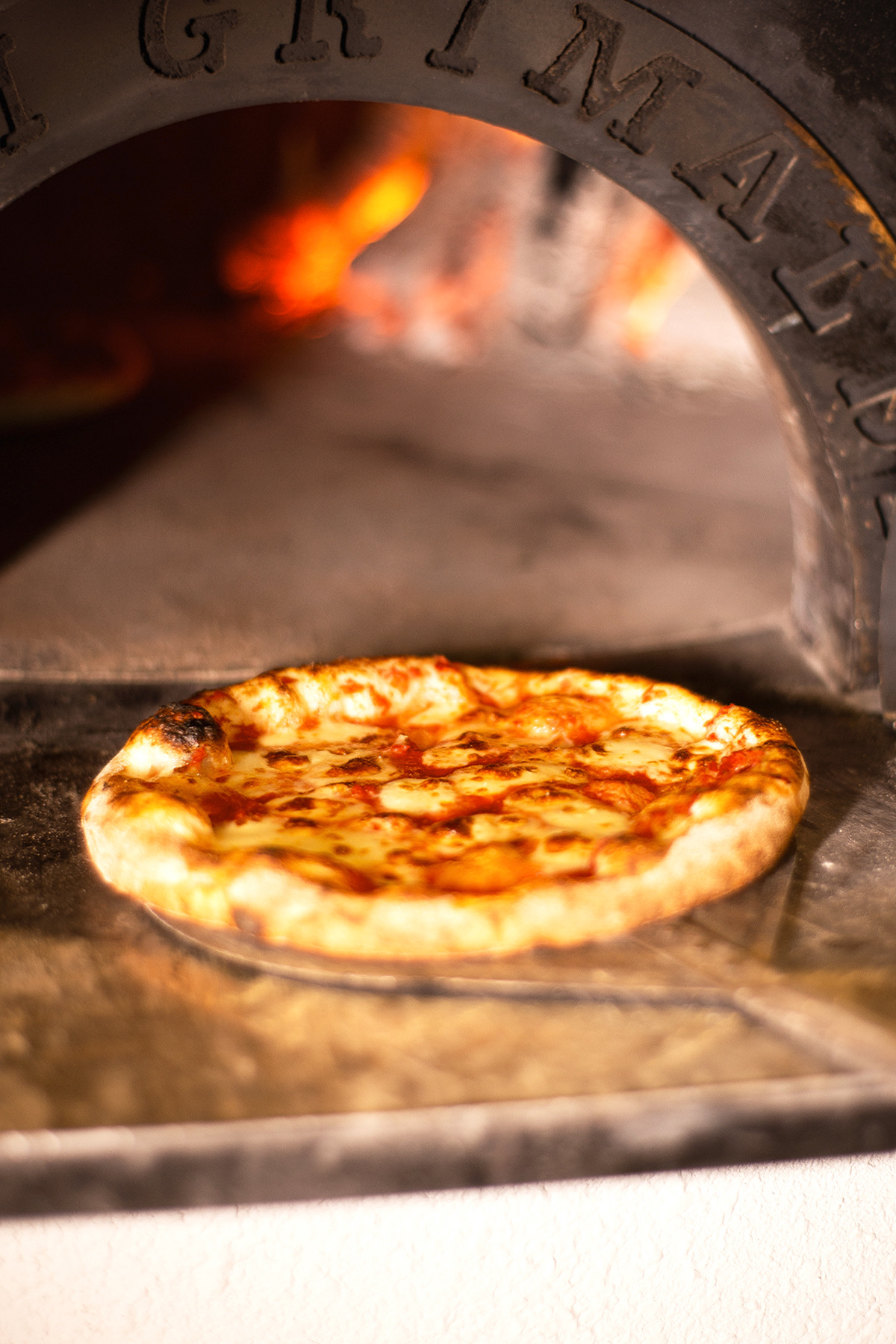 Pizza baking in the ORNO wood-fired oven
