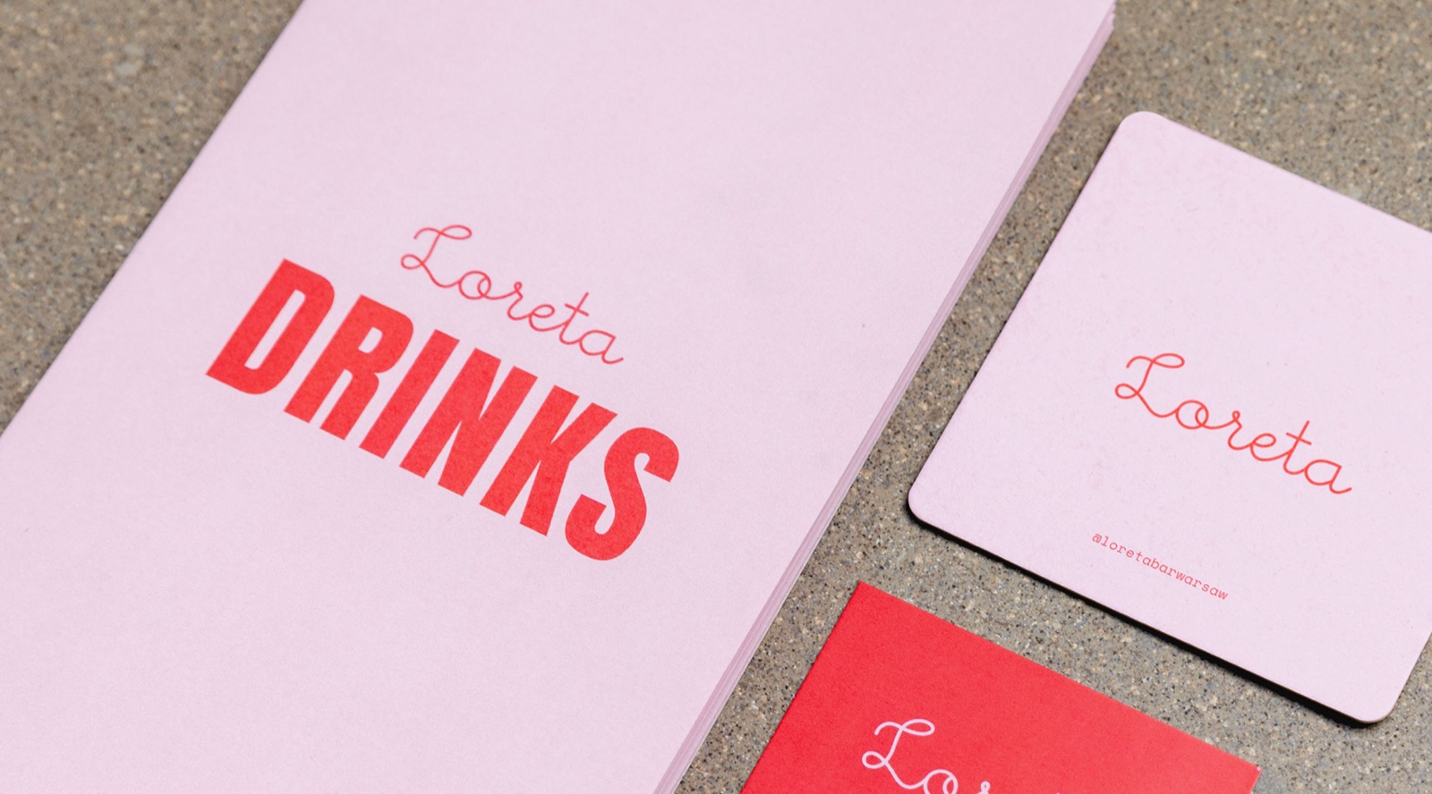 Loreta Drinks menu cover in pink and red with matching coasters