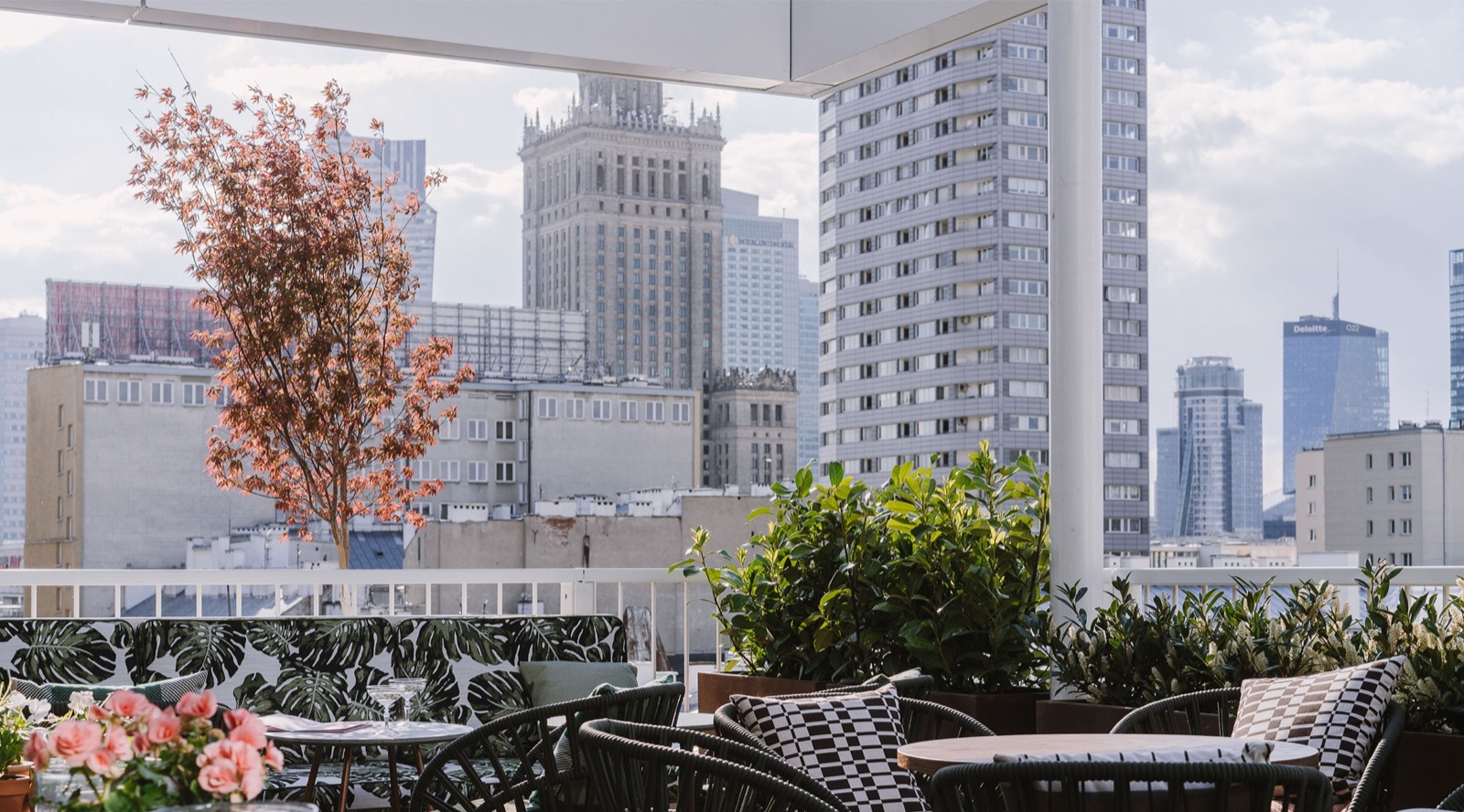 Loreta rooftop terrace with a view of the Warsaw skyline and Palace of Culture and Science
