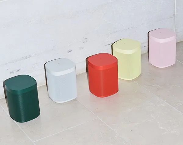 HAY x Sonos One speakers in green, white, red, yellow and pink on a pale floor