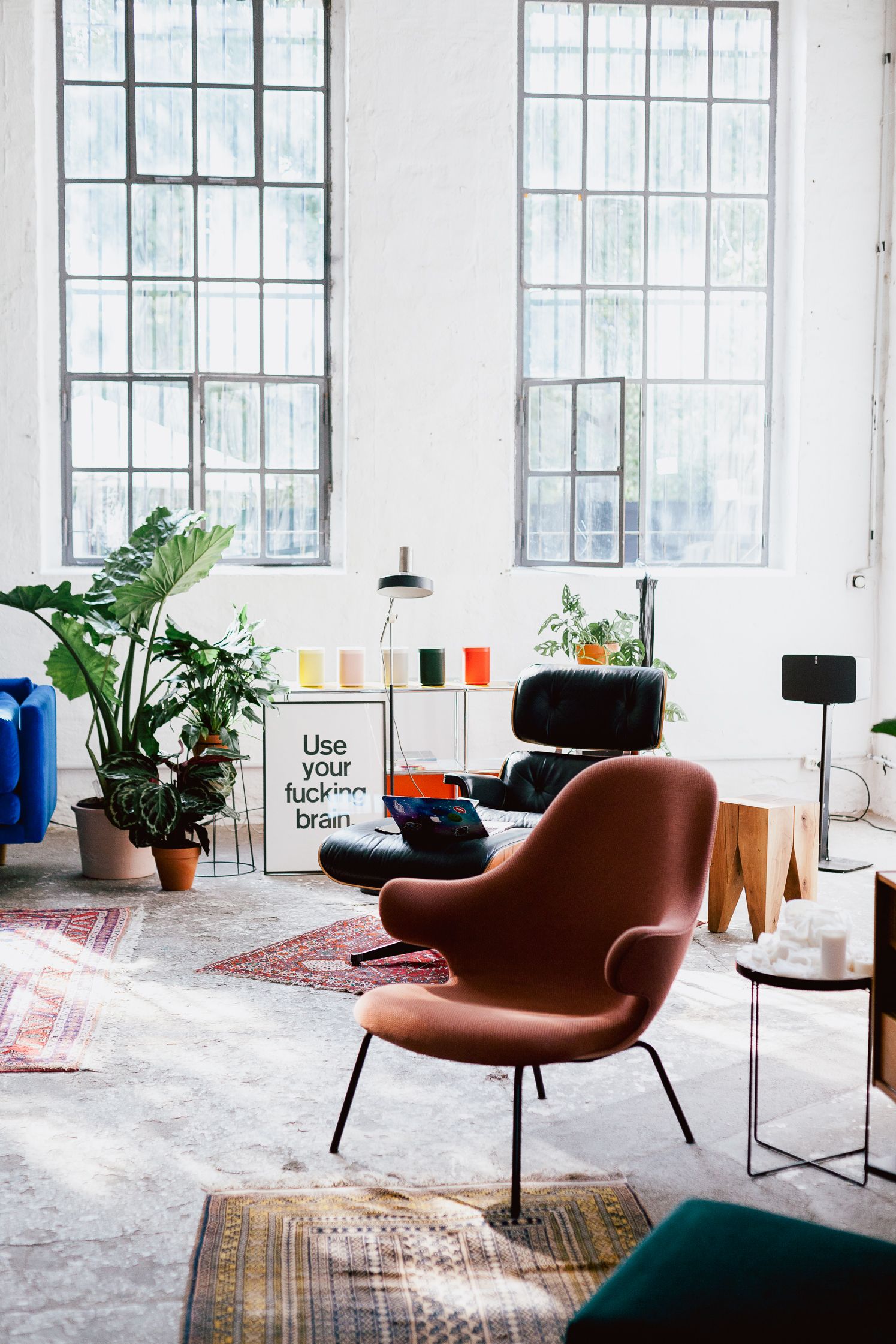 Listening lounge with a terracotta armchair, plants and speakers in the IFA hub loft