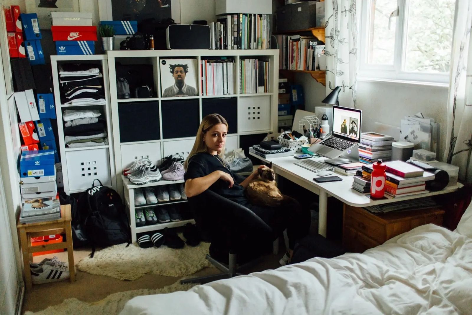 Photographer working at her desk in a bedroom studio, Sonos in-home editorial series