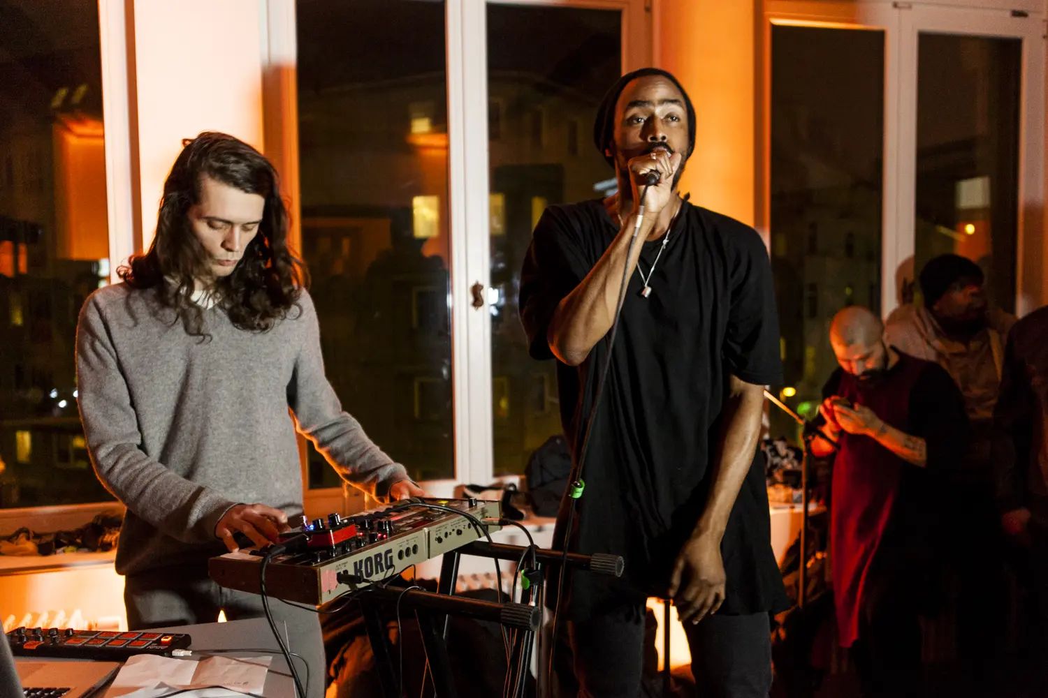 Live music set in a warmly lit room at the USM project50 anniversary event