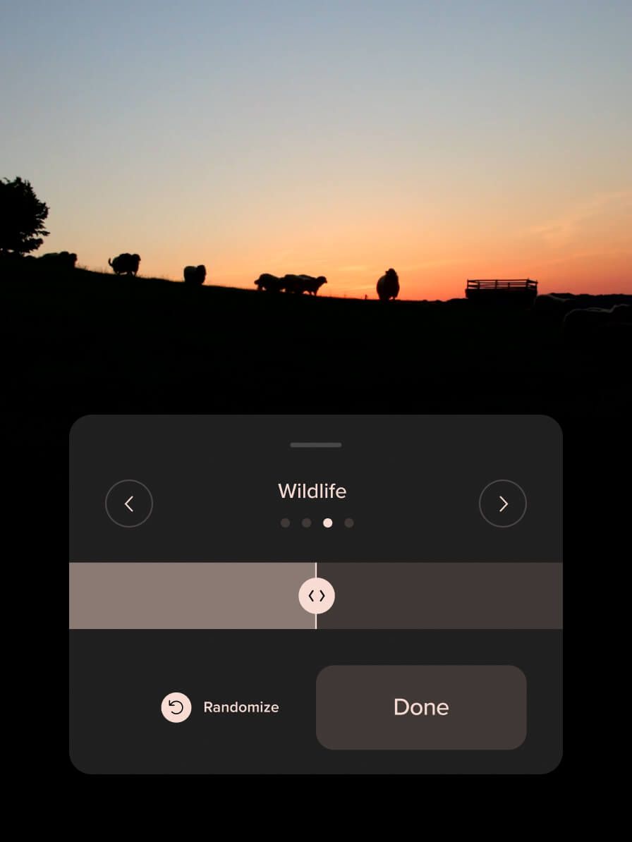 Mobile wildlife sound slider over a sunset with grazing animals