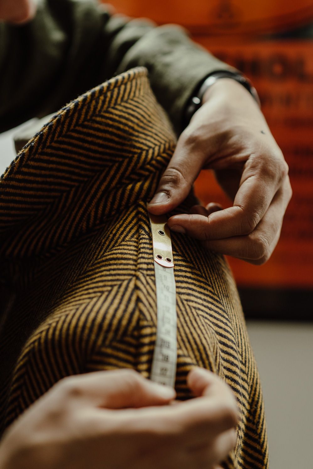 Hands holding a corduroy fabric sample