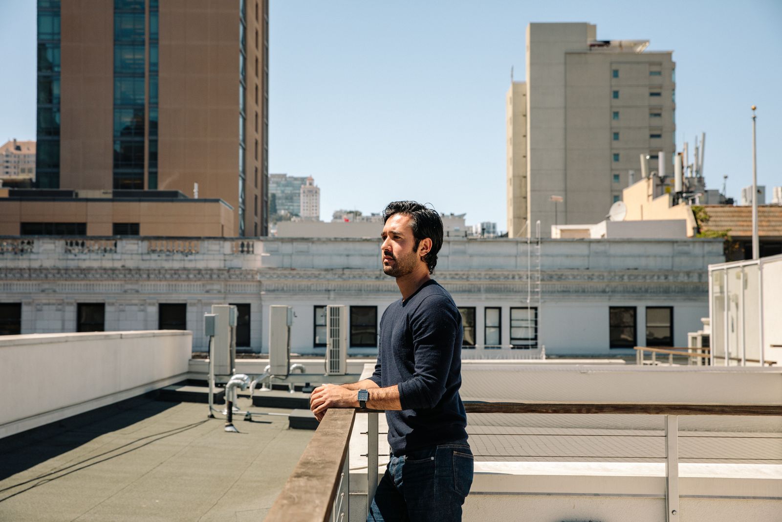 Agency partner on a rooftop looking across downtown San Francisco