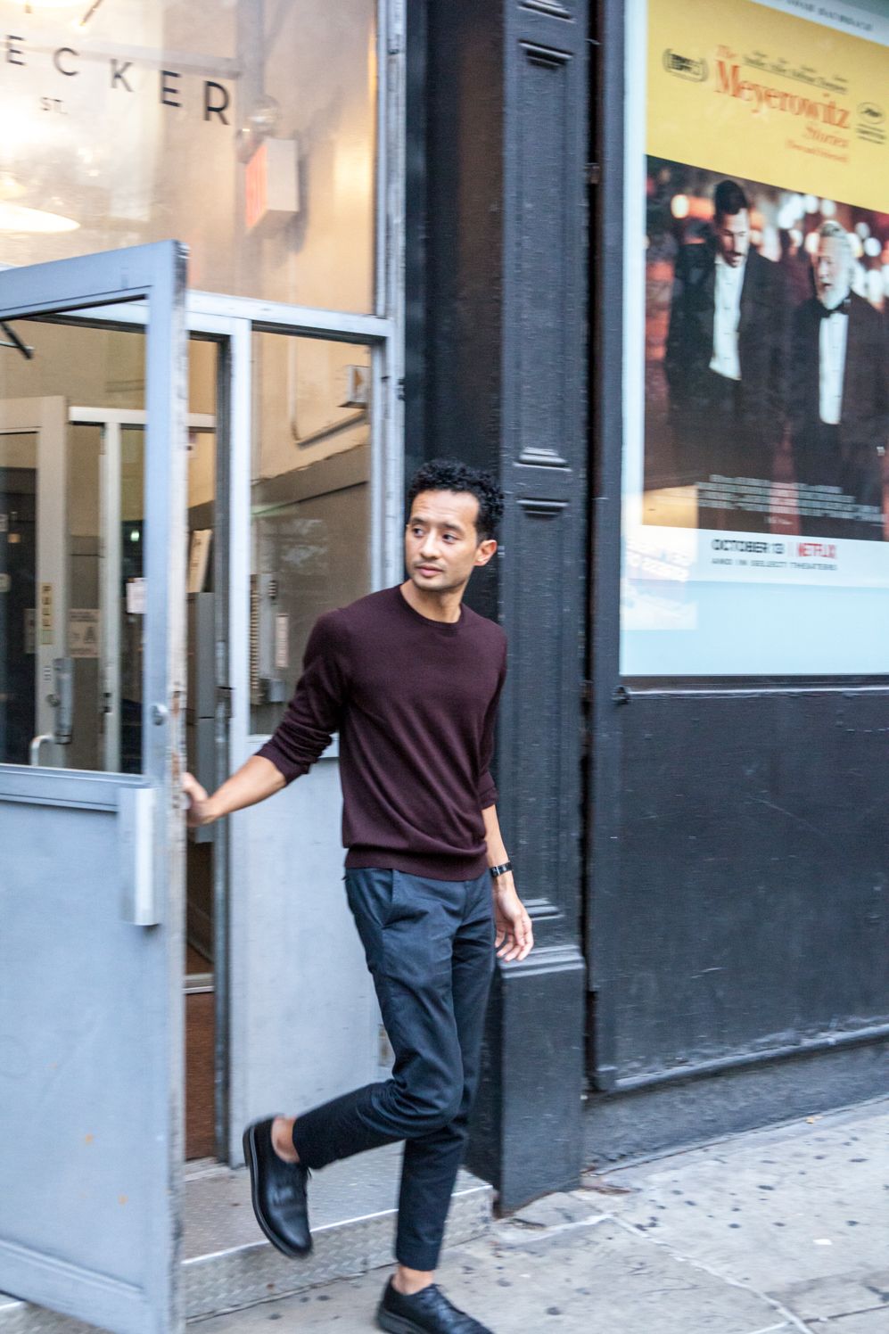 Founder stepping out of a shop doorway in Manhattan