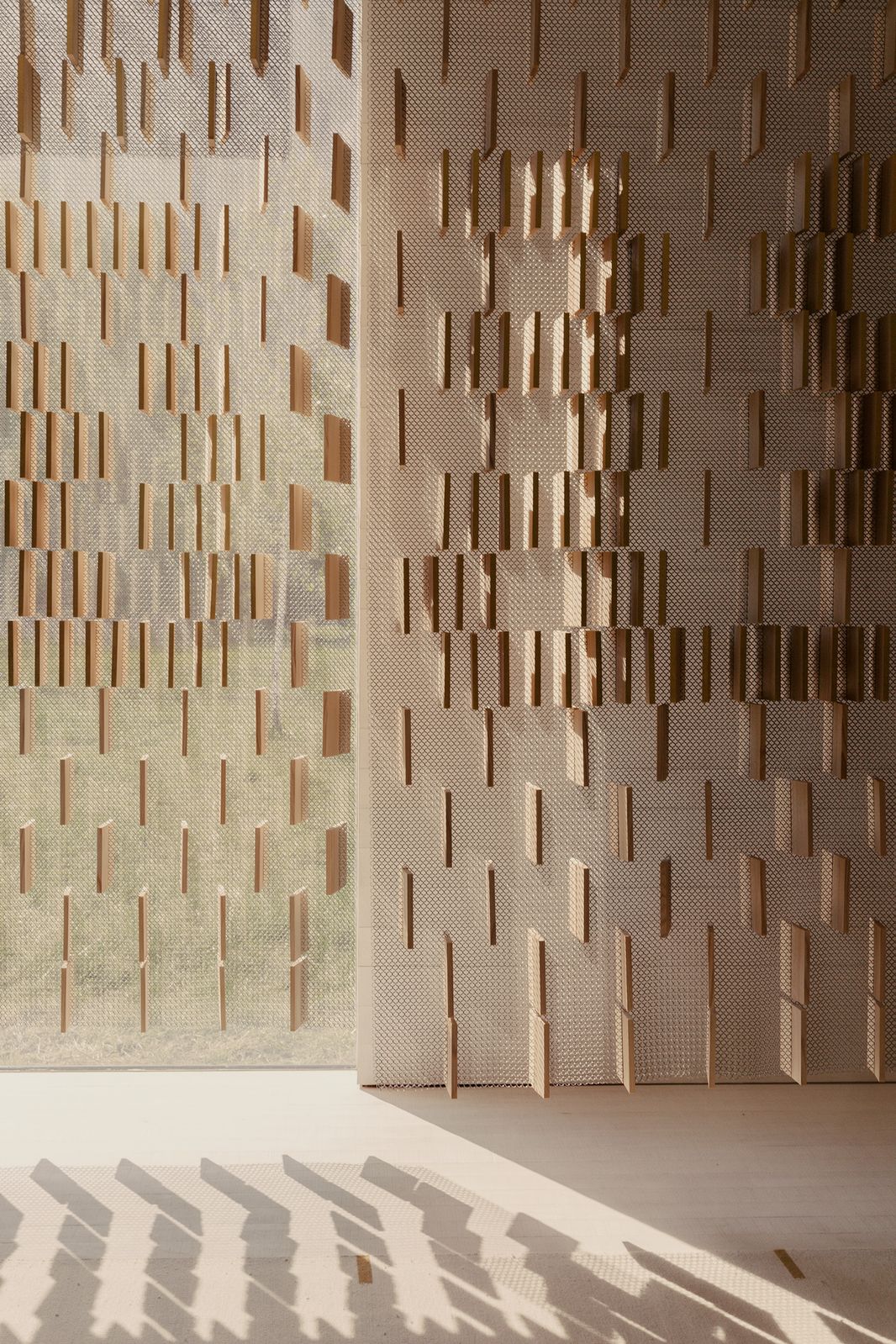 Daylight falling through a brick lattice wall