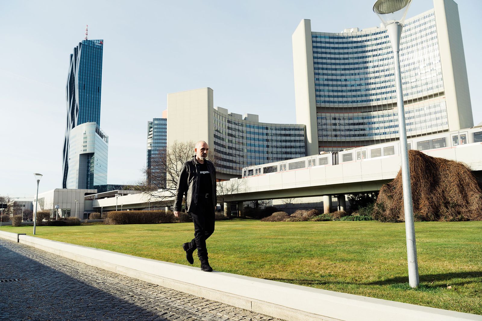 Harald Gründl walking across a lawn near the Vienna International Centre