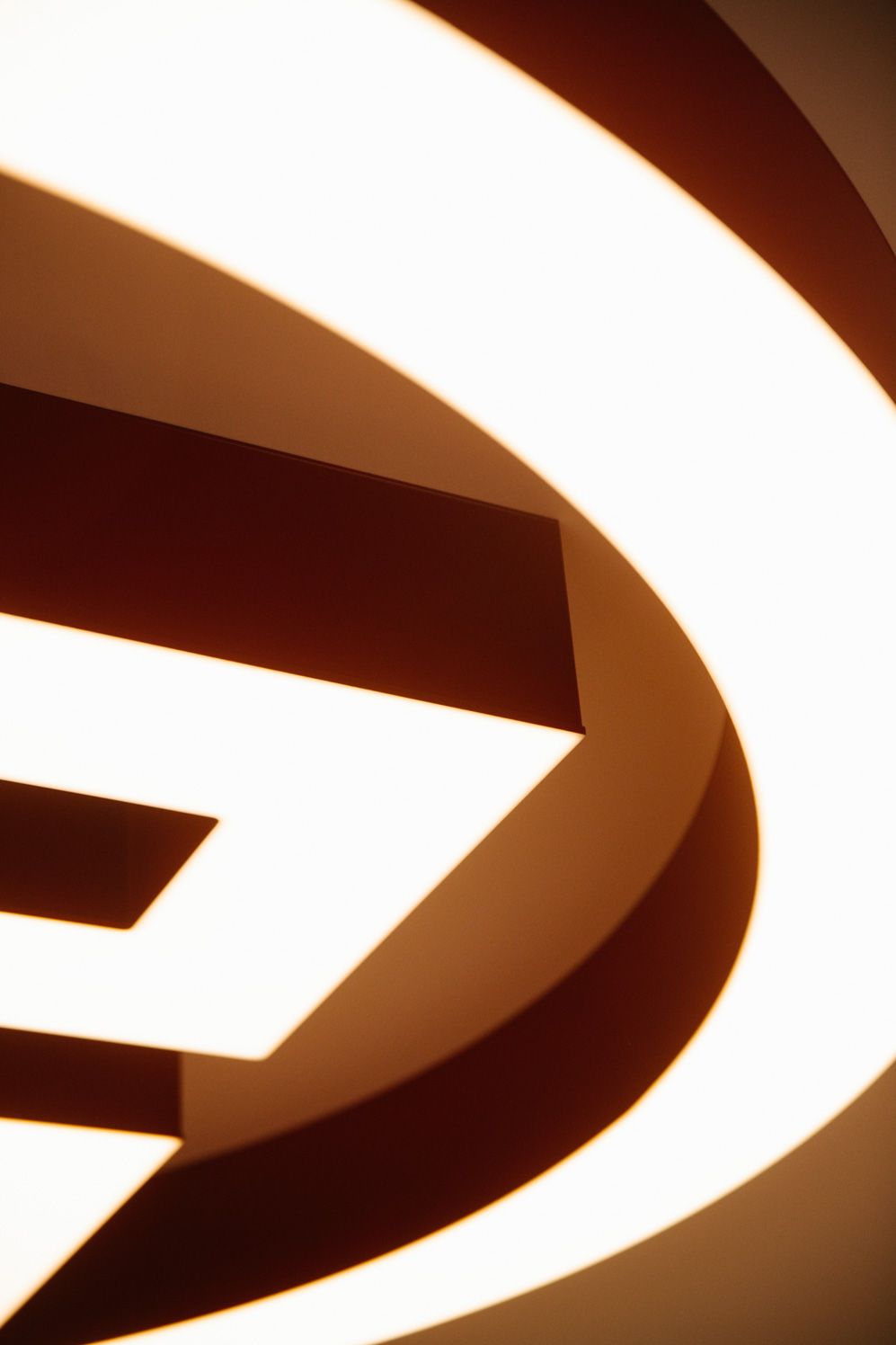 Close-up of a bespoke illuminated ceiling logo